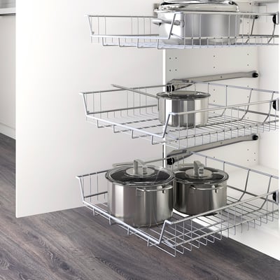 Kitchen wire baskets: organize pots, allow air circulation, easy access with pull-out stop.