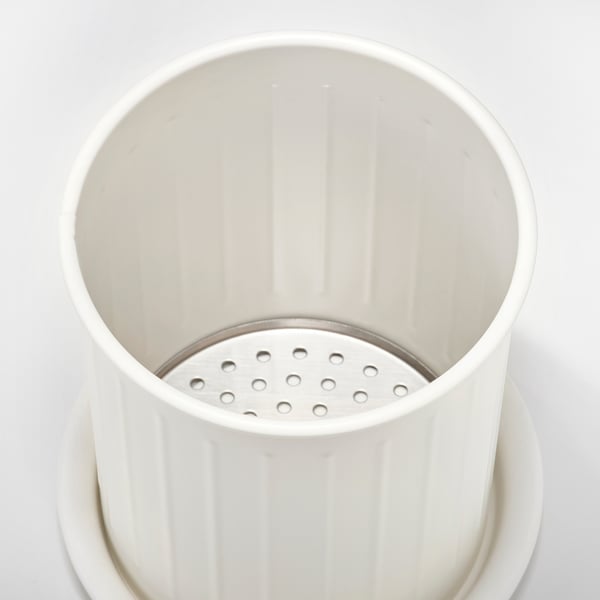 White dish drainer with vertical ribbing, stainless steel tray at bottom, galvanized steel construction.