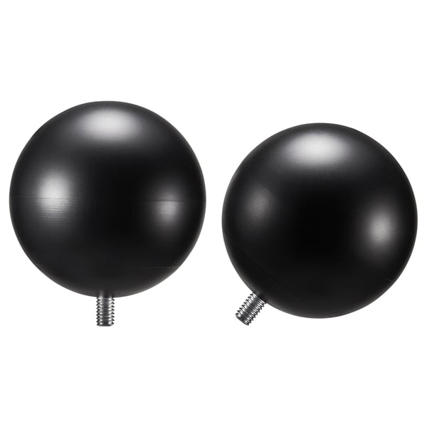 Two black, spherical VÄSENTLIG finials made from recycled plastic with a matte finish and metallic screws.