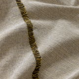 Textile with intricate yellow and blue fringed border, woven from recycled materials, showcasing high-quality craftsmanship.