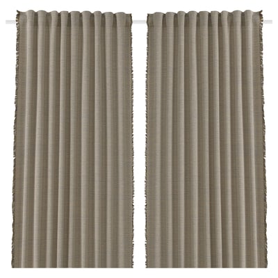 Two beige and brown striped curtains hang straight, featuring fringe edges, designed from recycled materials for energy efficiency and privacy.