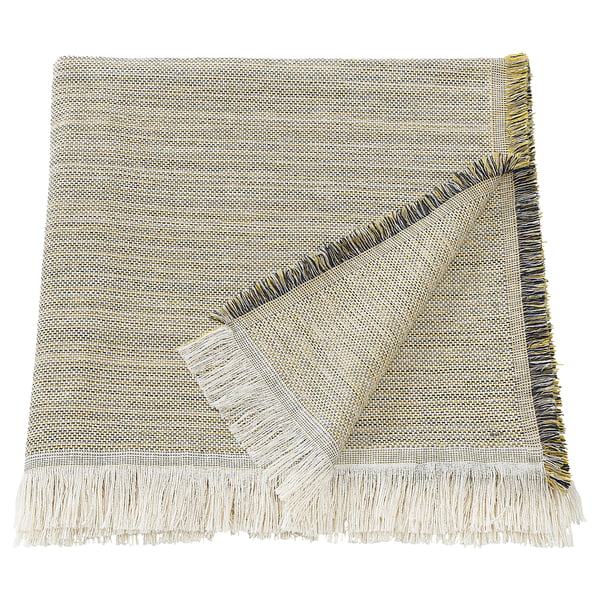 The VÄXELBRUK throw blanket is light brown and light grey with colorful fringes, rectangular shaped, made from recycled work clothes.