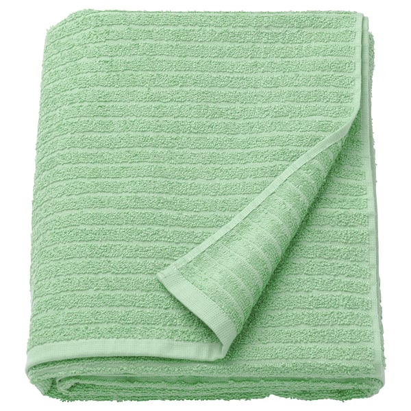 Green VÅGSJÖN bath towel, 100% cotton, ribbed, medium thickness, folded white background.