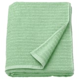 Green VÅGSJÖN bath towel, 100% cotton, ribbed, medium thickness, folded white background.