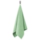 Light green VÅGSJÖN towel hangs from hook, soft terry texture, rectangular shape, vivid color.
