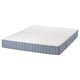 A white and grey rolled mattress named VALEVÅG, featuring comfort zones and pocket springs for support.