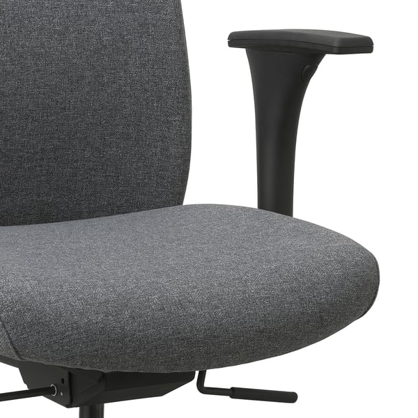 Close-up of ergonomic office chair showing high-quality fabric, adjustable armrest, and supportive seat and backrest.