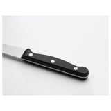 Knife with black handle and silver blade, positioned diagonally on white surface.