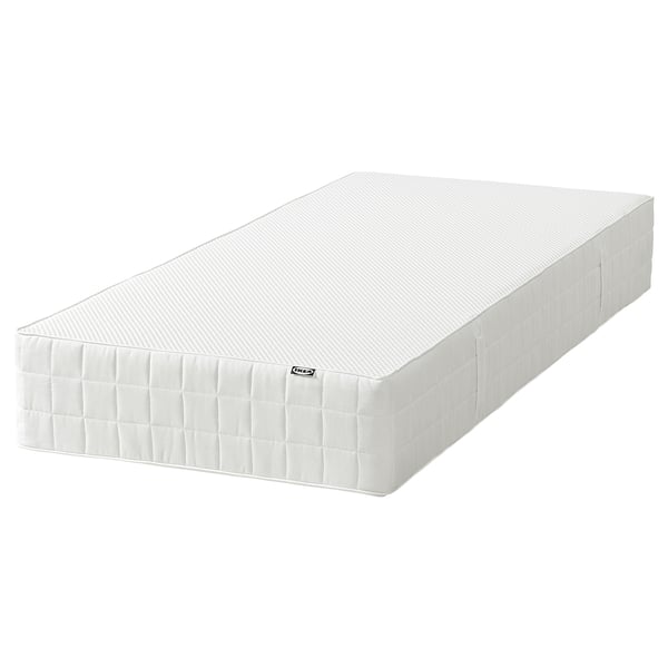 White IKEA mattress with quilted sides, rectangular, memory foam padding.