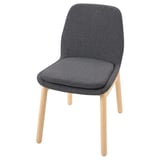 A grey upholstered VEDBO chair with a wooden frame. It a high back and curved shape for comfort.