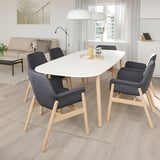 Modern dining set with VEDBO table & dark chairs, bright room.