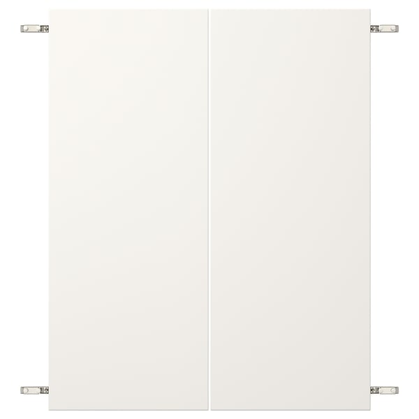 Blank white paneled door with nickel-plated hinges.