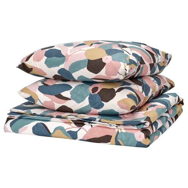 Vibrant leaf bedding set in pink, blue, green on white. Soft cotton-lyocell blend, includes duvet cover and pillowcases.