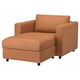 Orange sofa chair, VIMLE, with storage footrest, leather upholstery, modern design.