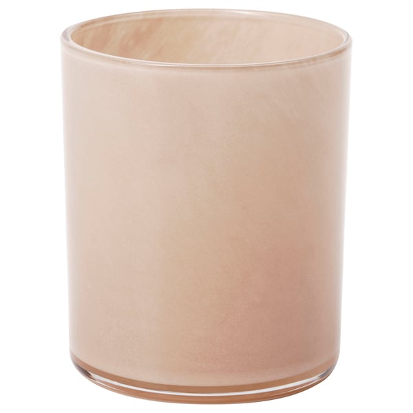 Peach-colored, cylindrical glass candle holder.