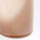 Handcrafted glass vase with warm hue and mouth-blown texture.