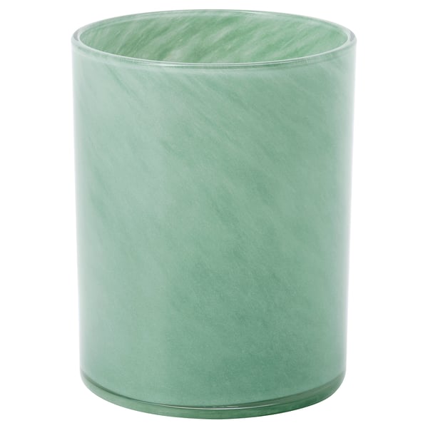 Green, cylindrical glass candle holder with swirl design.