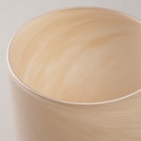 Beautiful glass candle holder, handcrafted with delicate patterns, reflecting warm candlelight.