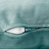 Close-up of high-quality zipper on soft, textured aqua-green fabric, showcasing durability and comfort.