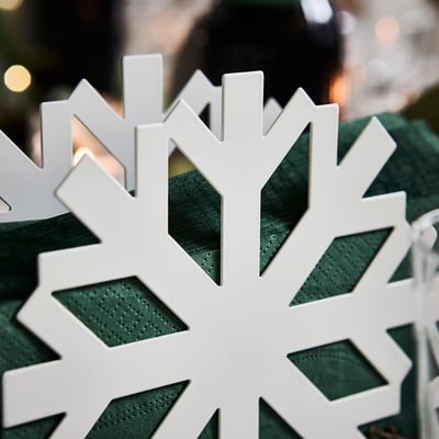 A white VINTERFINT snowflake-shaped item, made of plastic and metal, designed for holding items.