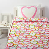 Bright pink bedding with multicolored hearts; fits twin bed, smaller than nightstand and pillow.