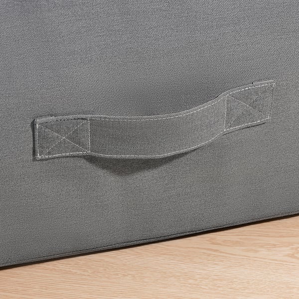 Close-up of VITHÄLL pouffes sturdy zipper and fabric handle, showcasing quality craftsmanship.
