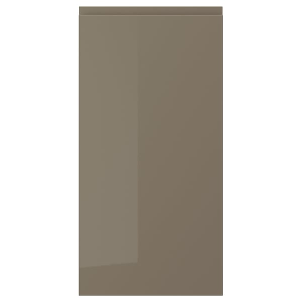 A sleek VOXTORP cabinet door in dark grey-brown with a high gloss finish. It has an integrated handle for a modern look.