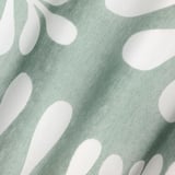 Green sheer curtains with abstract shapes. Recycled polyester fabric.