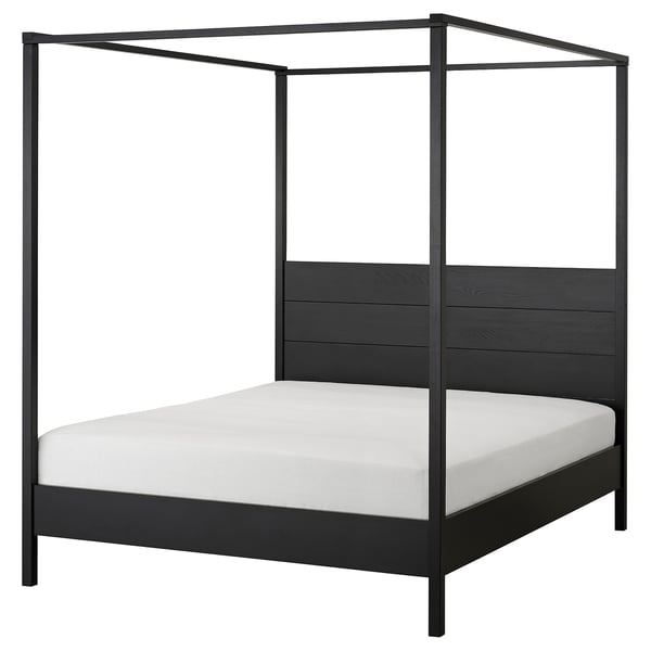 A modern four-poster bed, YTTERVÅG, in dark gray with a solid wood headboard and adjustable sides, perfect for contemporary bedrooms.