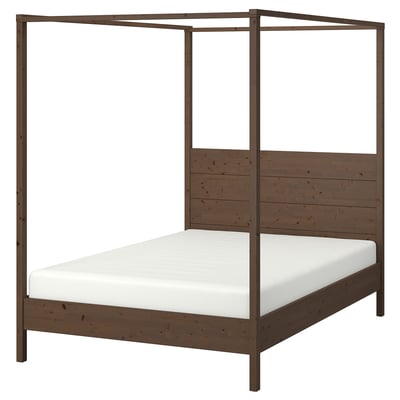 YTTERVÅG dark brown wooden four-poster bed with white mattress. Simple scandinavian style with high headboard and metal posts.