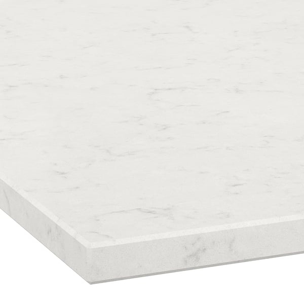 White marble countertop with smooth, polished surface and subtle veins.