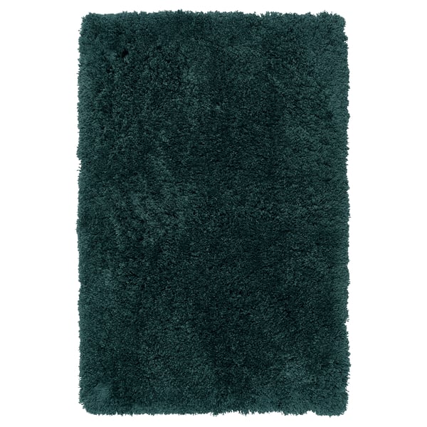 Fluffy blågrøn bademåtte, rektangulær, blød høj luv. Fremstillet af genanvendt polyester, kan maskinvaskes.