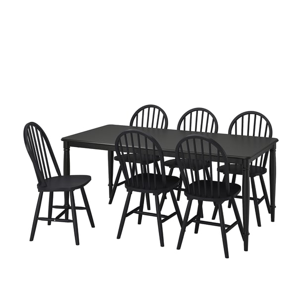 Sort 6-personers spisebordssæt, klassiske træstole, robuste metalbordben, moderne traditionelt design.