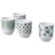 Mulighed: Fire grønmønstrede hvide porcelænskrus med prikker, striber, blomster og bladmotiver arrangeret i en gruppe.