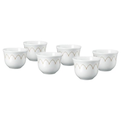 Fem hvide porcelænskopper med gyldent zigzag-design arrangeret på række.