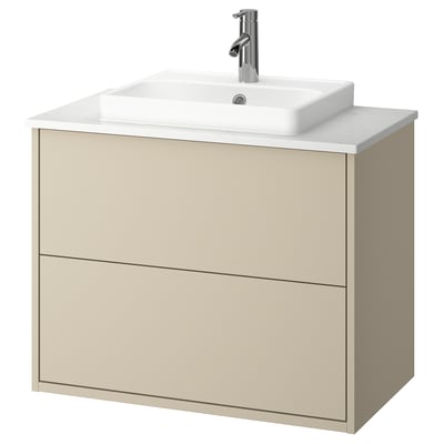 Moderne beige badeværelsesvask med hvid bordplade og håndvask.