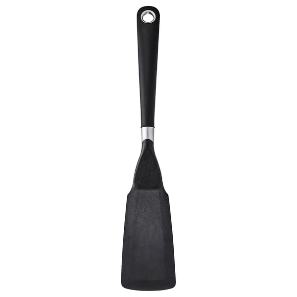 Ikea spatel, sort, med et grebsvenligt håndtag og non-stick overflade, perfekt formet til at vende mad.