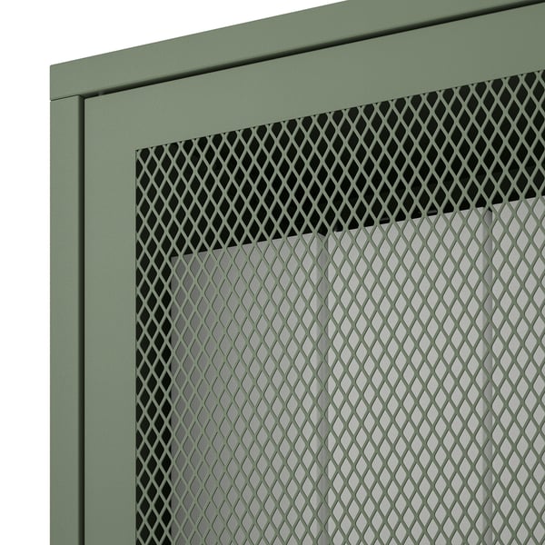 Grønt metalnetskab, en del af IVAR-systemet. Viser holdbart design med minimal affaldsproduktion.