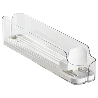 En klar KLIPPKAKTUS drikkedrikholder i plast, designet til at organisere dåser og flasker i et køleskab. Den kan justeres i siderne og en frontåbning for nem adgang.