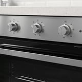 Ovnkontrolpanel i rustfrit stål med tre knapper. Temperatur- og funktionsindstillinger synlige.