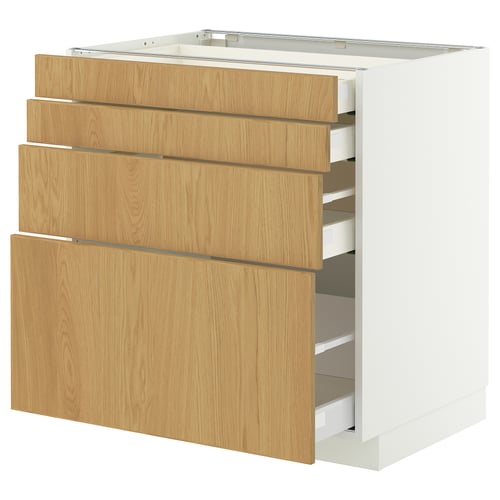 Dette billede viser et ikea METOD køkkenelement med tre træskuffer i lys egetræsfinish og et hvidt underskab.