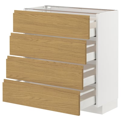 Viser et METOD køkkenskab med fire lyse træfarvede skuffer og en hvid bund. Designet er et minimalistisk look med integrerede håndtag.