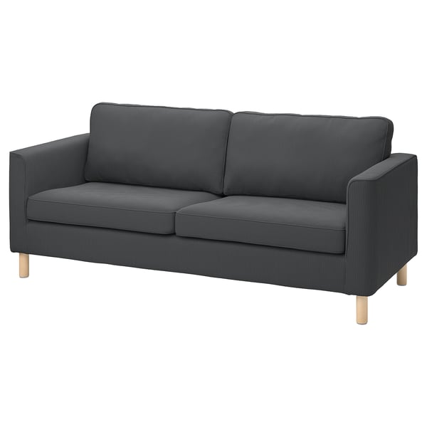 En PÄRUP sofa i mørkegrå fløjl med lyse træben med et moderne og elegant design.