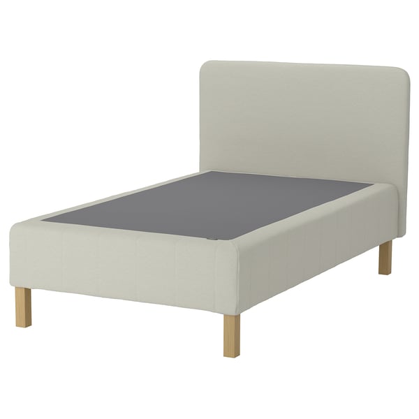 Moderne minimalistisk sengestel: hvid polstret, grå madras, træben.