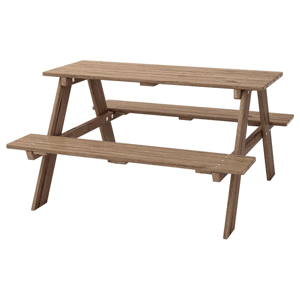 Brunt picnicbord til børn med påsatte sæder, udført i massivt akacietræ.