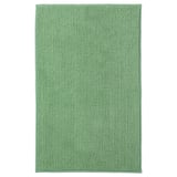 En grøn TOFTBO bademåtte. Den er rektangulær, blød og fremstillet af genanvendt polyester med en struktureret overflade.