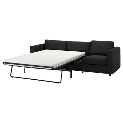 Mørkegrå konvertibel sofa, slankt og moderne design med rene linjer, polstret sæde og ryg, ideel til kompakte rum.