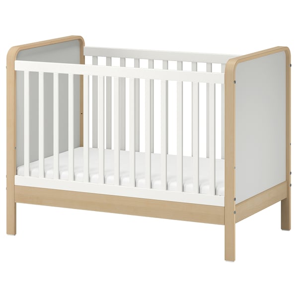 ÄLSKVÄRD white & light wood baby cot with removable side, adjustable base, and guard rail.