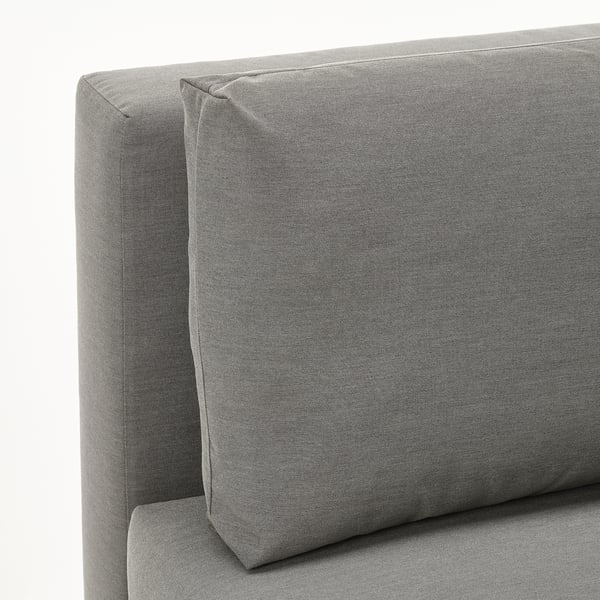 Grey upholstered sofa with clean, modern lines; foldable backrest; textured fabric; showcasing durability and comfort.