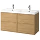 Modern oak double bathroom vanity with sleek white sinks and chrome faucets.